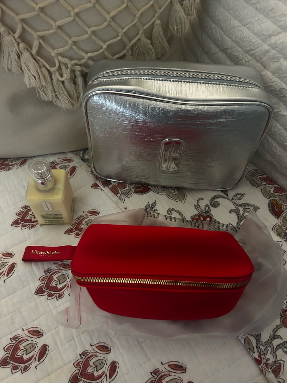 Clinique cream and bag and Elizabeth Arden Red Zip Cosmetic Case